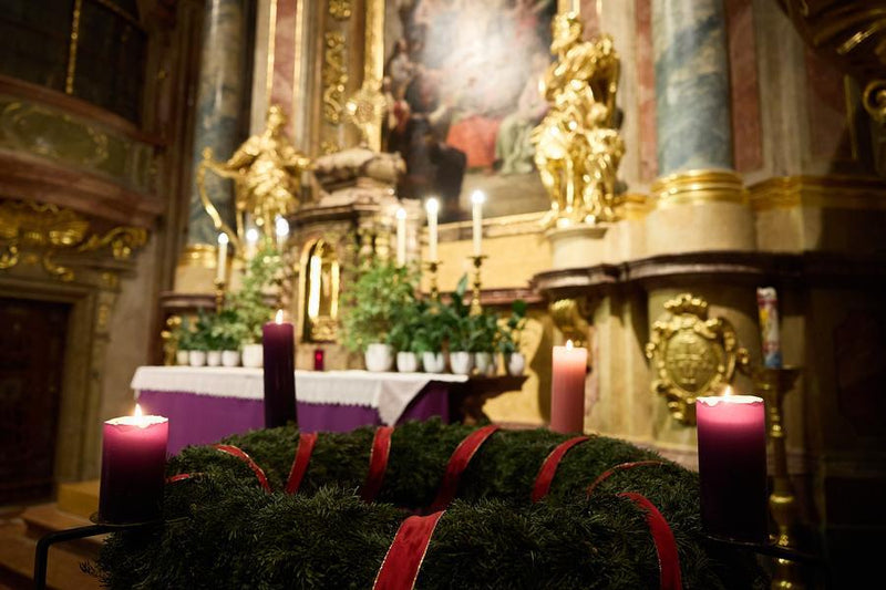 View of the baroque interior of St. Anne's Church illuminated for a holiday trumpet concert.